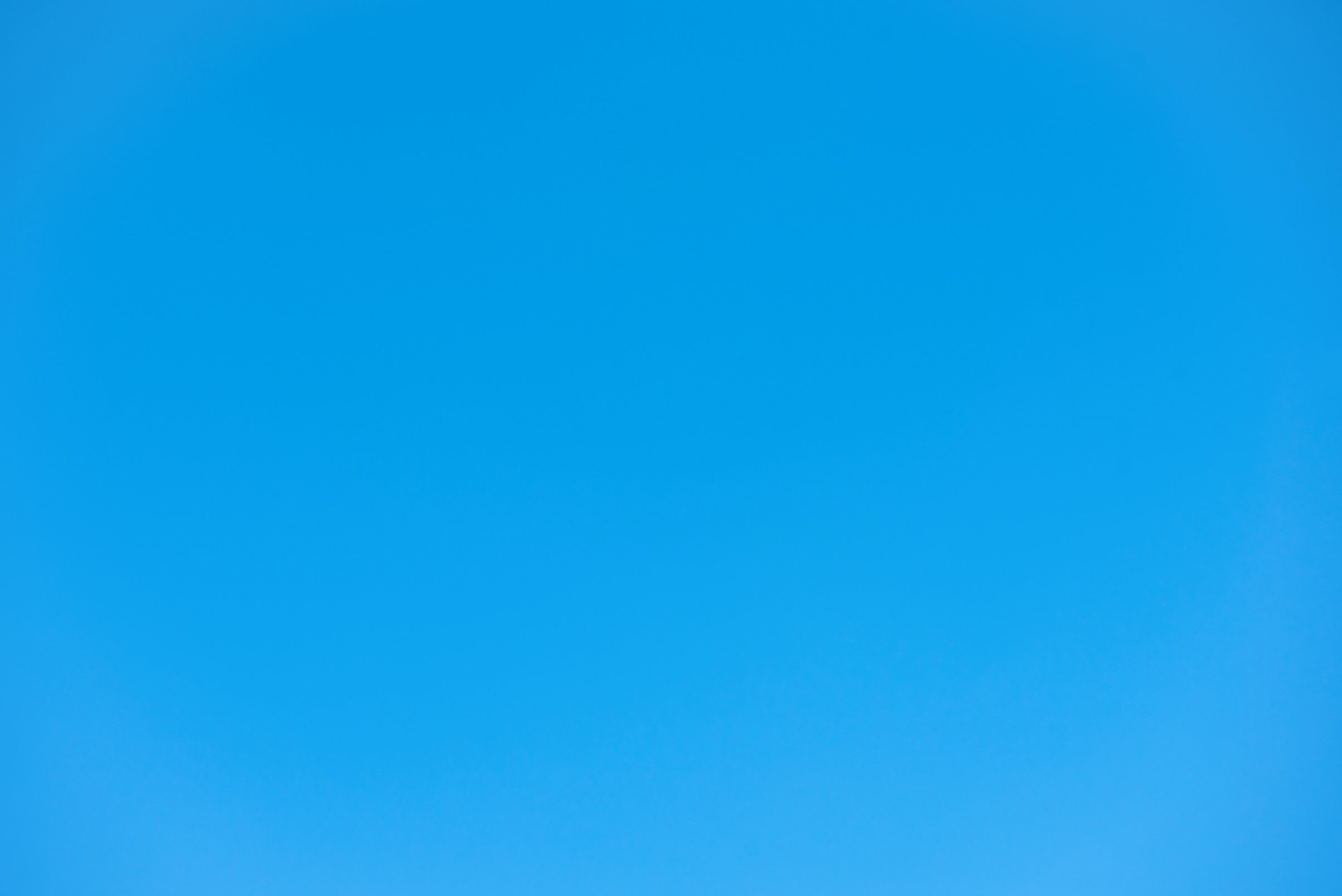 Cloudless clear summer light blue sky for background